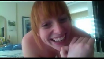 A Redheaded Webcam Model Pleasures Herself For Viewers