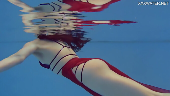 Marfa, A Small-Framed Russian Girl, Enjoys Swimming Naked In Her Pool